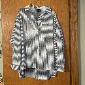 Long sleeve over-sized gray and white, button down, collared shirt.